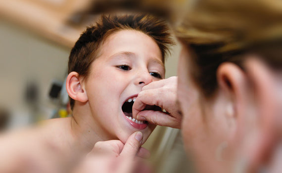 How to Pull Out a Loose Tooth for Kids [+ Make it a Magical Moment]